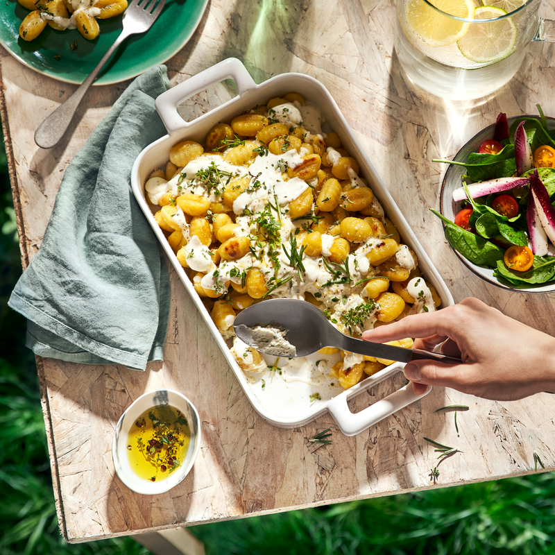 Gratin de gnocchis au fromage ail et fines herbes